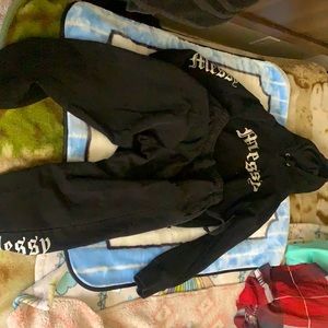 Hoodie black jacket and sweat pants that say Messy